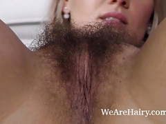 Find-Best-Lingerie.com presents: Jehanna strips naked and fingers her hairy pussy