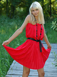 Find-Best-Lingerie.com presents: Naughty teen appears in her sexy red dress and starts removing it passionately and moving slowly.